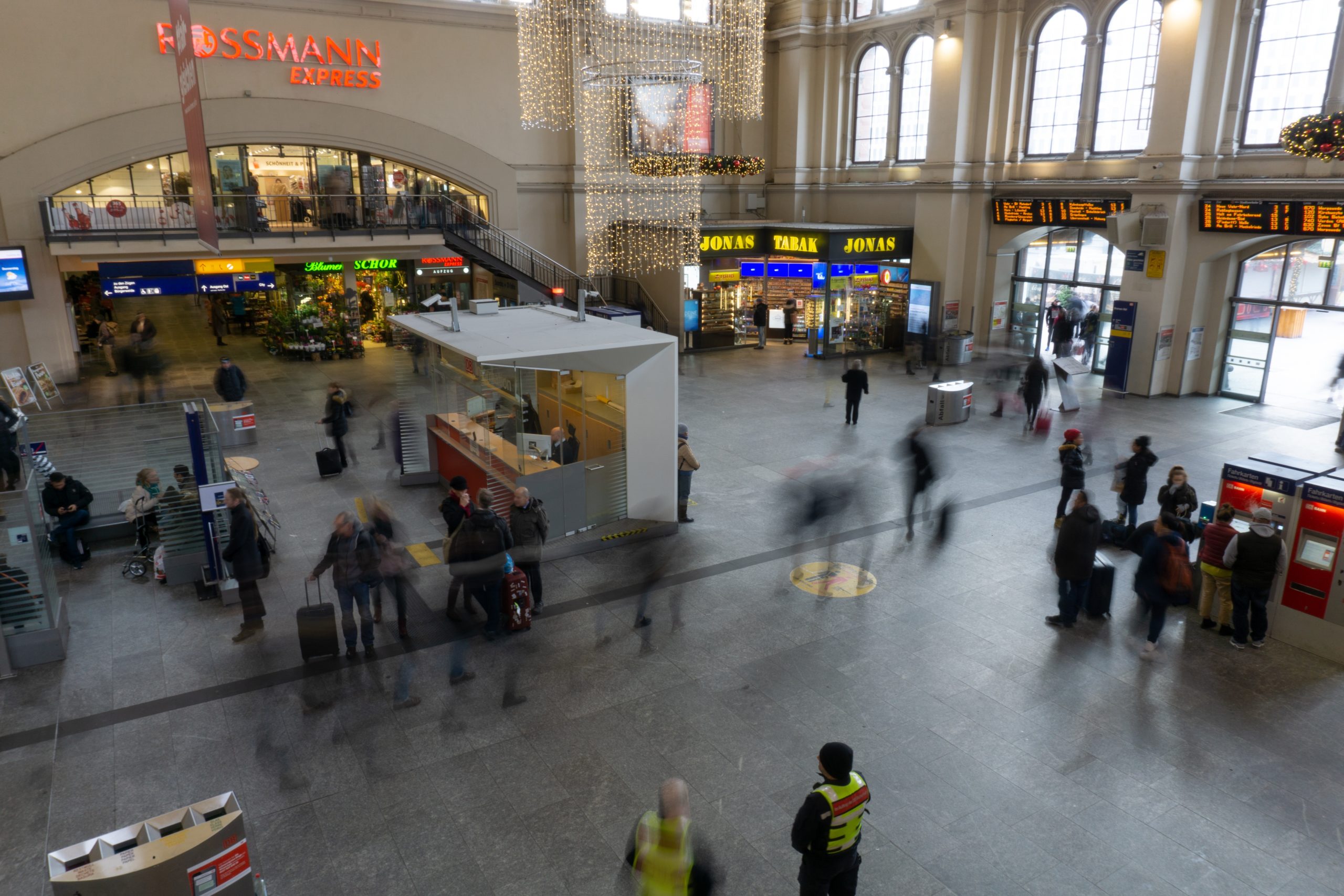 Business travelers walking in a train station.